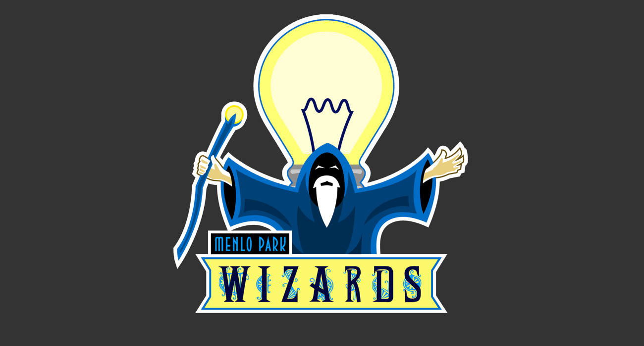 A becloaked wizard standing in front of a giant lightbulb, representing Thomas Edison The Wizard of Menlo Park!